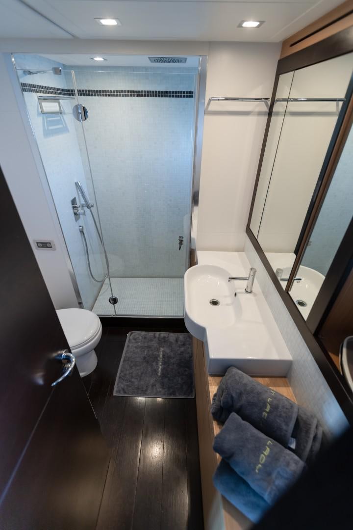 a bathroom with a tub sink and toilet aboard FIRST LADY Yacht for Sale