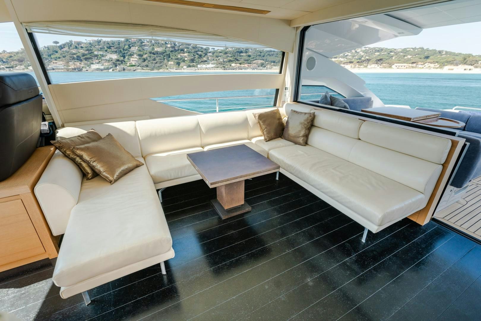 a living room with a couch and a table aboard FIRST LADY Yacht for Sale