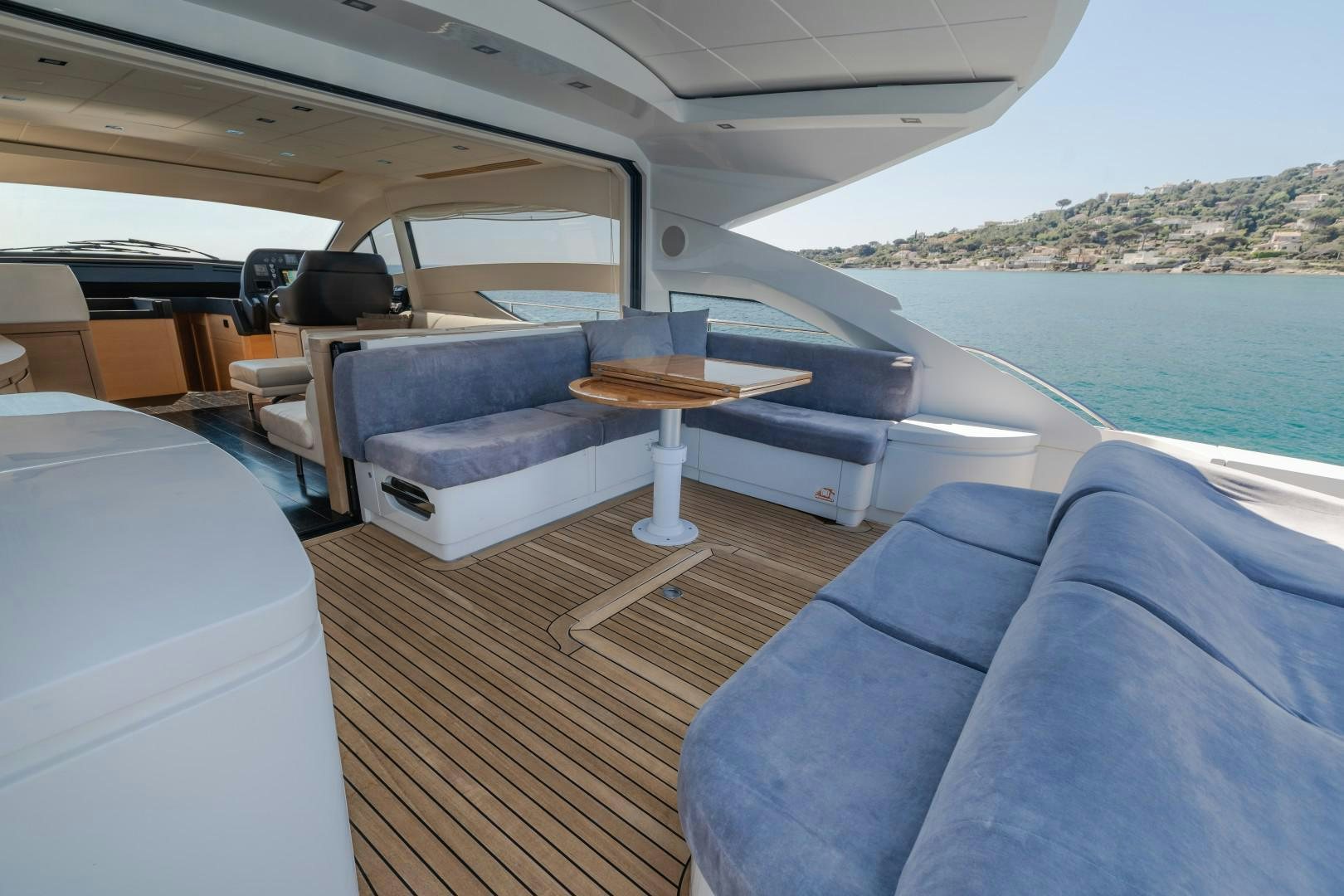 a boat with a table and chairs aboard FIRST LADY Yacht for Sale