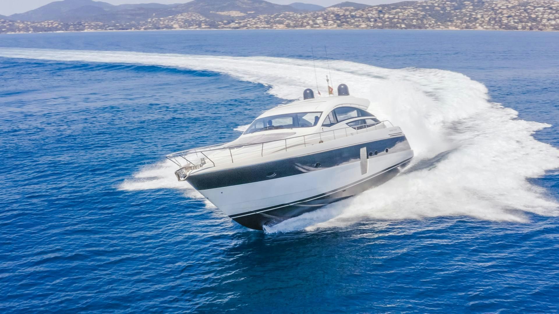 a white yacht on the water aboard FIRST LADY Yacht for Sale