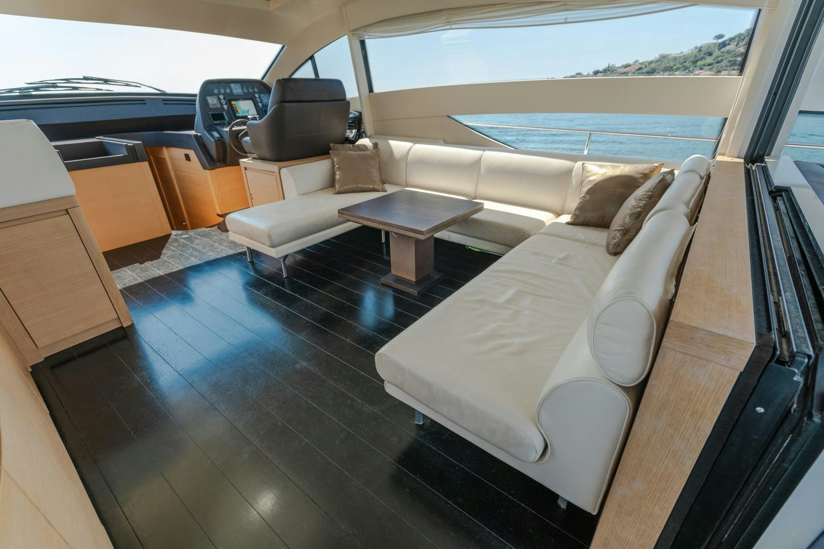 a living room with a couch and a table aboard FIRST LADY Yacht for Sale