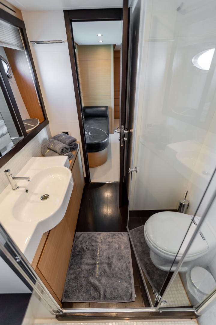 a bathroom with a sink toilet and a bathtub aboard FIRST LADY Yacht for Sale