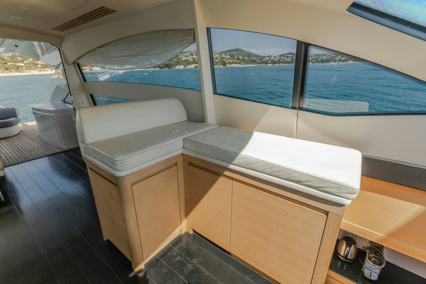 a room with a large window and a view of the ocean aboard FIRST LADY Yacht for Sale
