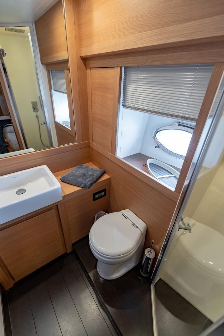 a bathroom with a sink and a toilet aboard FIRST LADY Yacht for Sale
