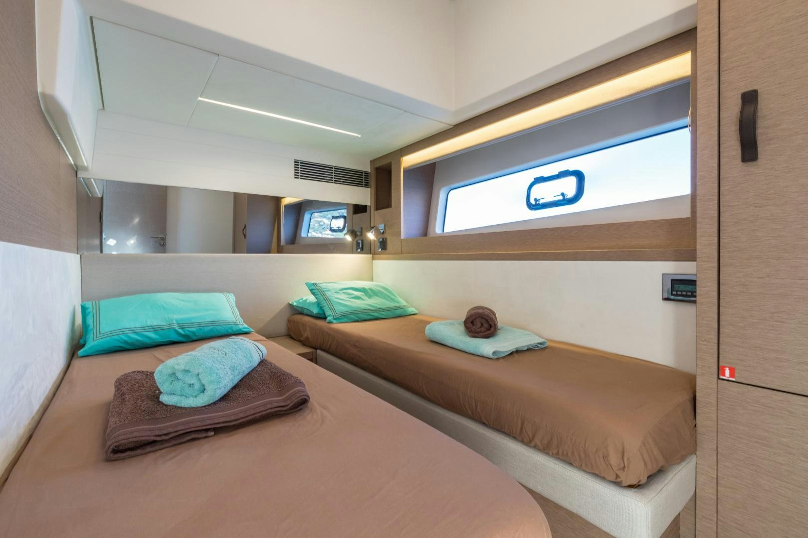 a room with two beds aboard LA HUNE 4.0 Yacht for Sale