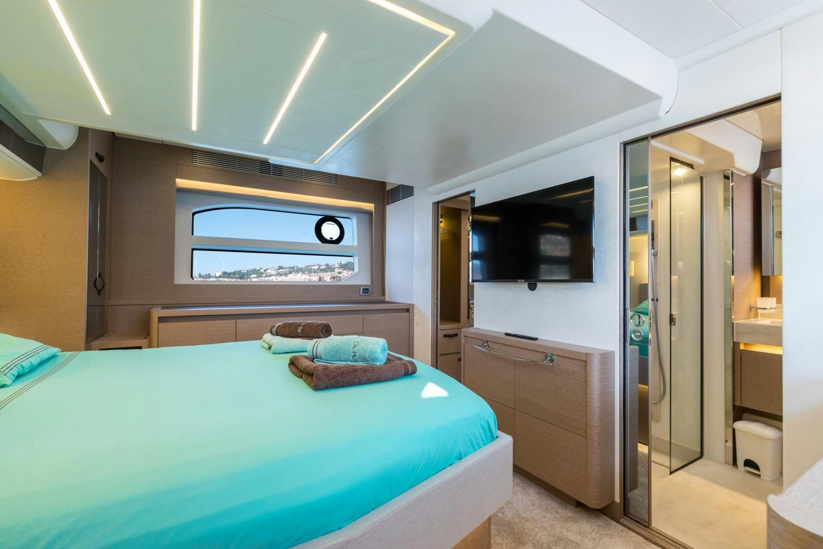 a bedroom with a bed and a television aboard LA HUNE 4.0 Yacht for Sale