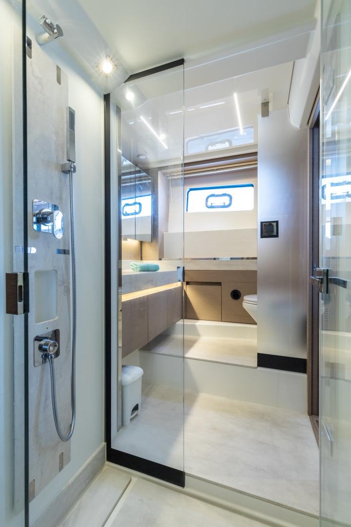 a bathroom with a glass shower aboard LA HUNE 4.0 Yacht for Sale