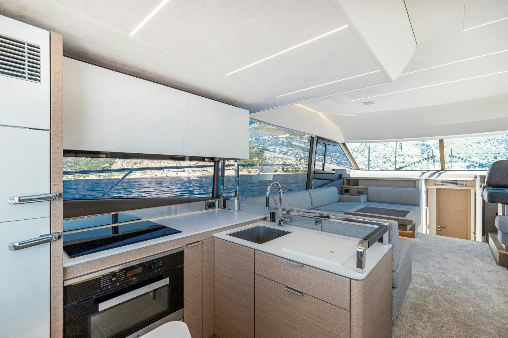 a kitchen with a large window aboard LA HUNE 4.0 Yacht for Sale