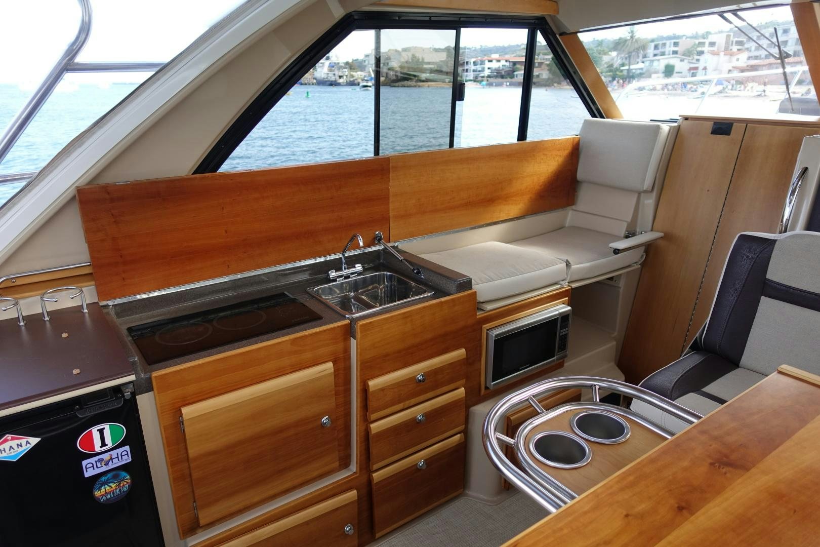 a kitchen with a wood table aboard OHANA Yacht for Sale