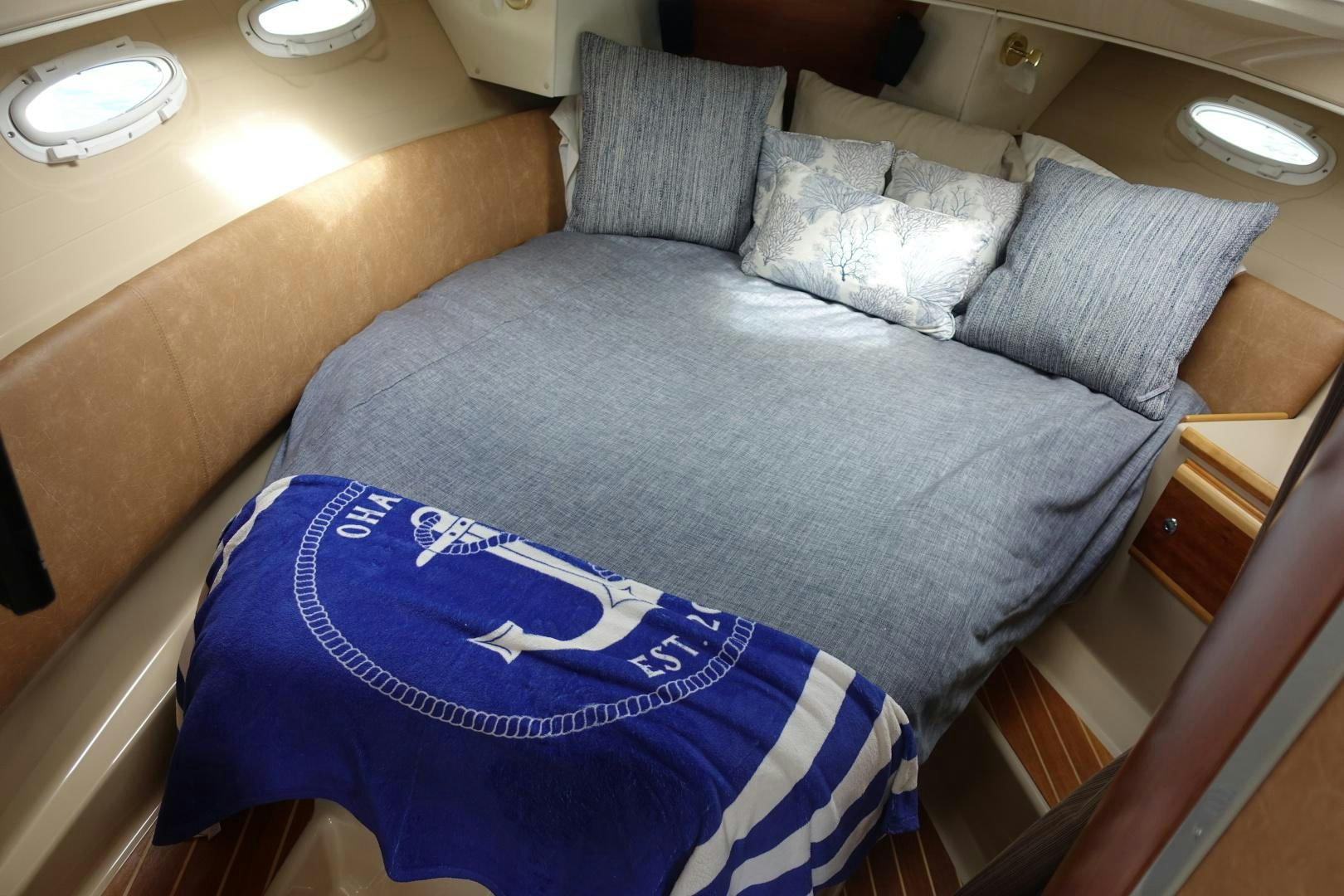 a bed with pillows aboard OHANA Yacht for Sale