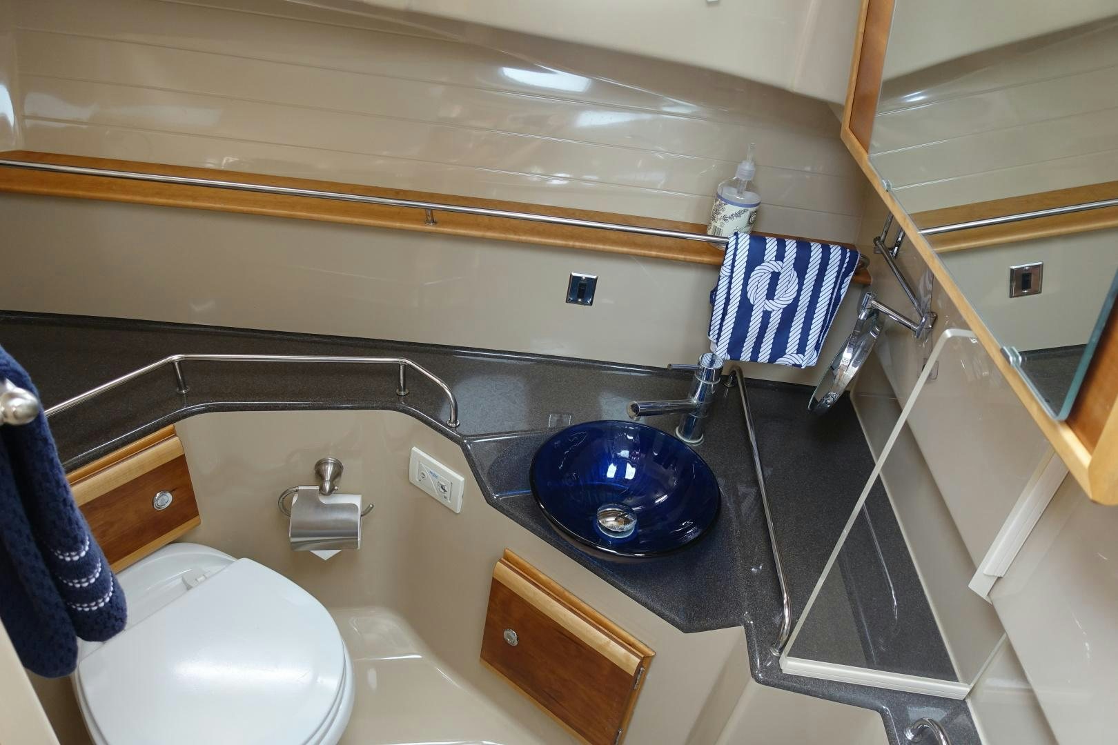 a bathroom with a sink and a toilet aboard OHANA Yacht for Sale