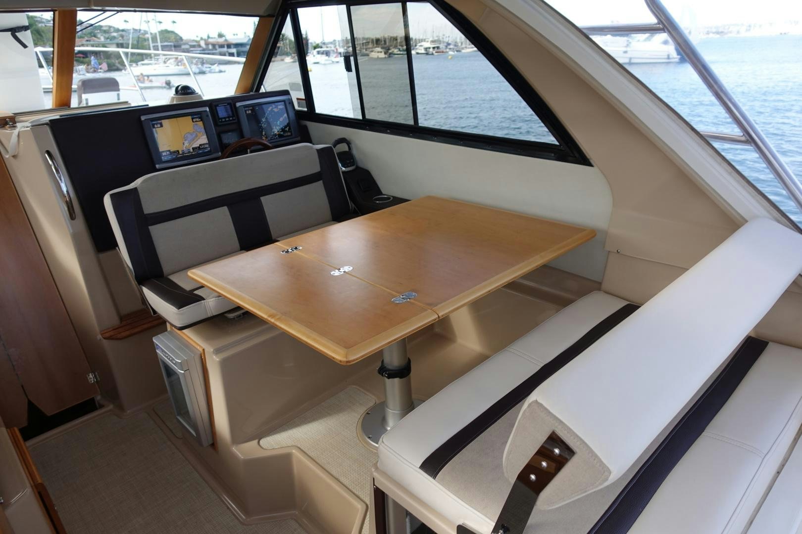 a table with a laptop on it aboard OHANA Yacht for Sale
