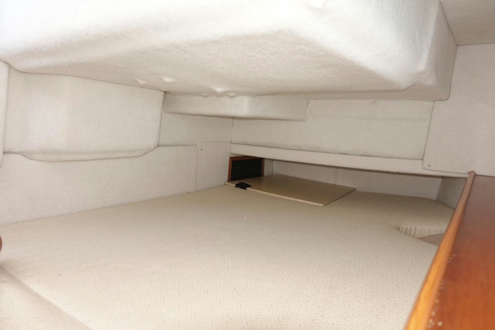 a room with a couch and a white wall aboard OHANA Yacht for Sale