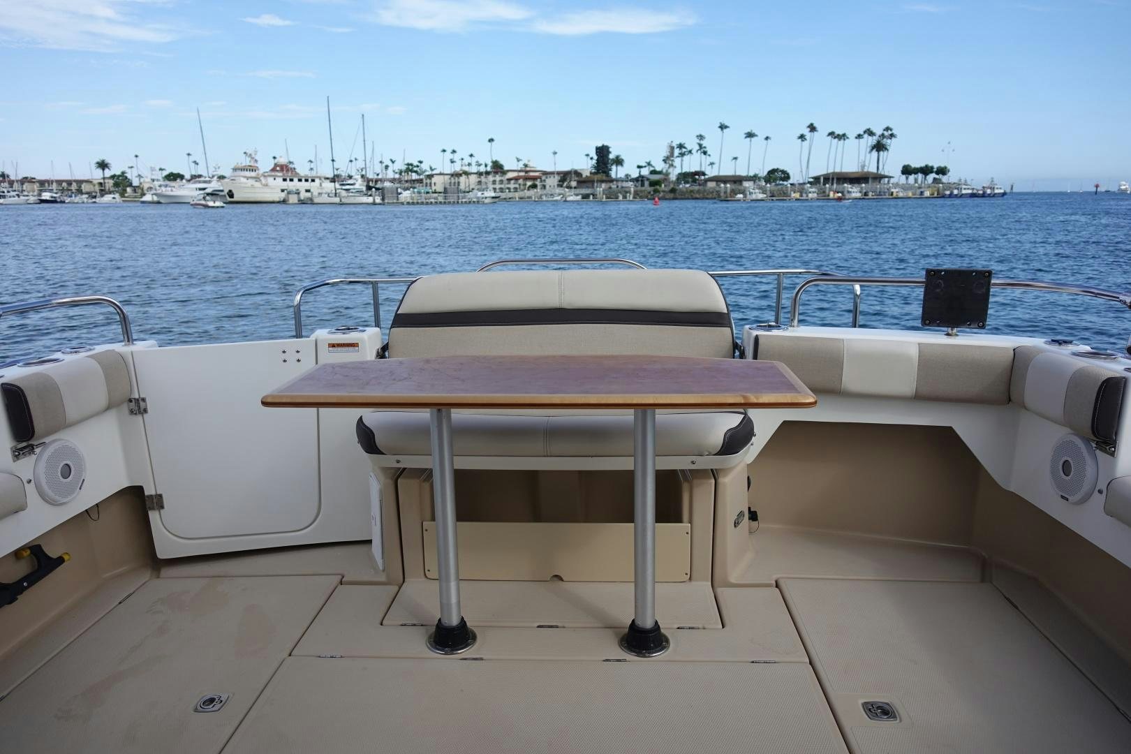 a couple of white tables on a boat in the water aboard OHANA Yacht for Sale