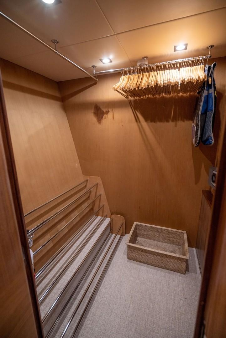 a hallway with a chandelier aboard SPLASHED OUT Yacht for Sale