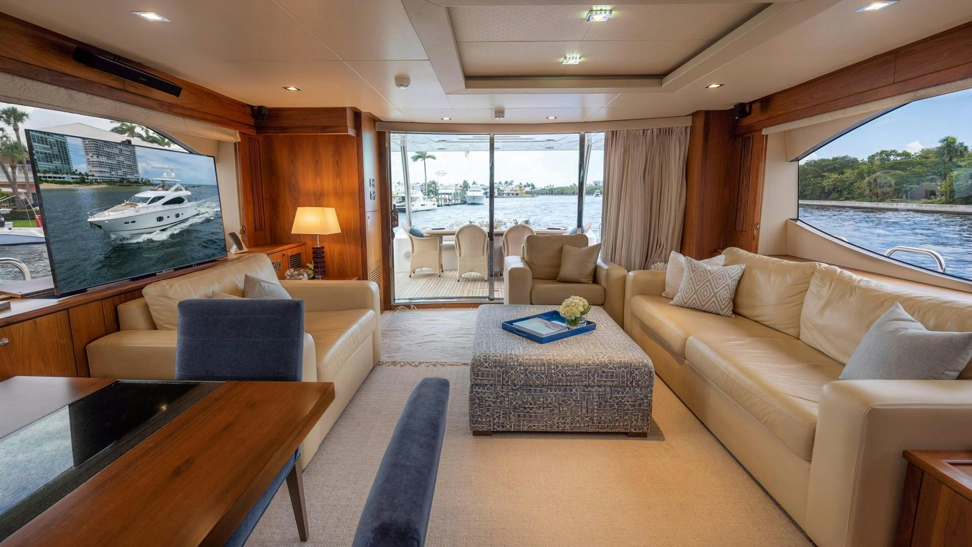 a living room with a large window aboard SPLASHED OUT Yacht for Sale