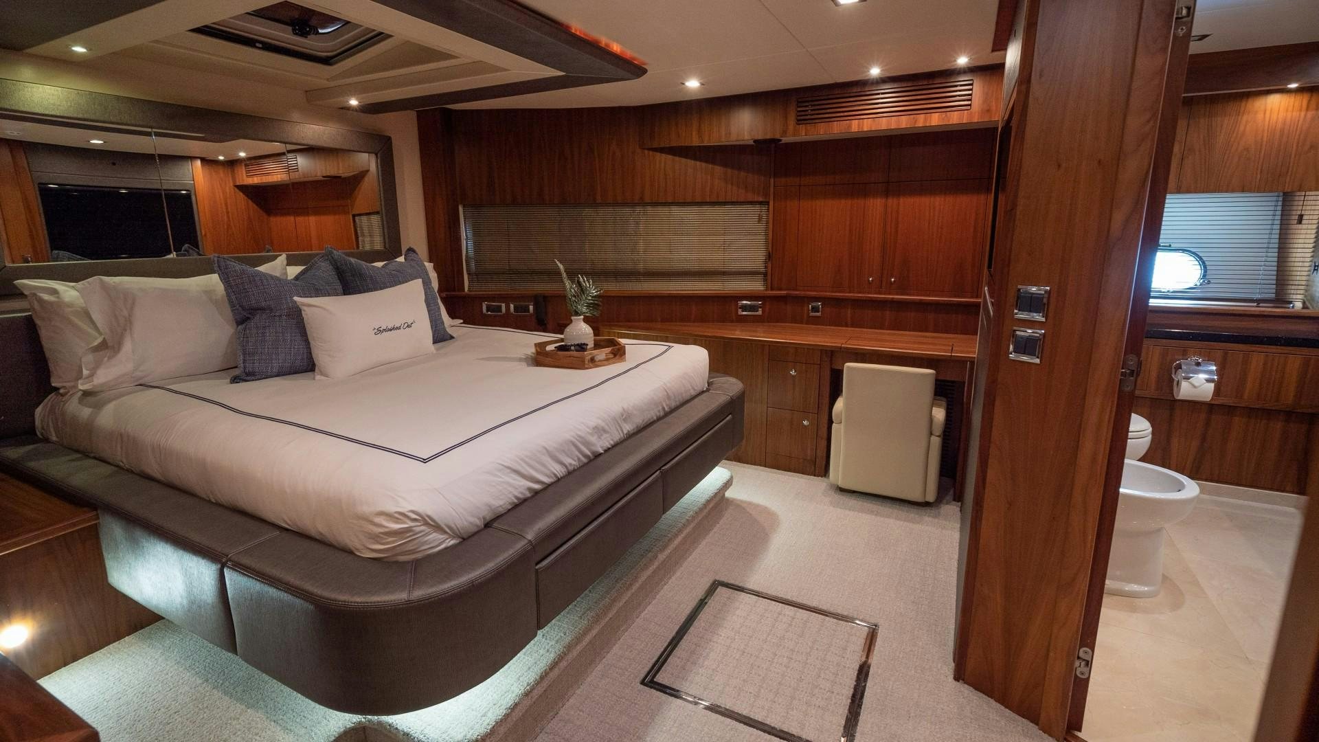 a room with a bed and a desk aboard SPLASHED OUT Yacht for Sale