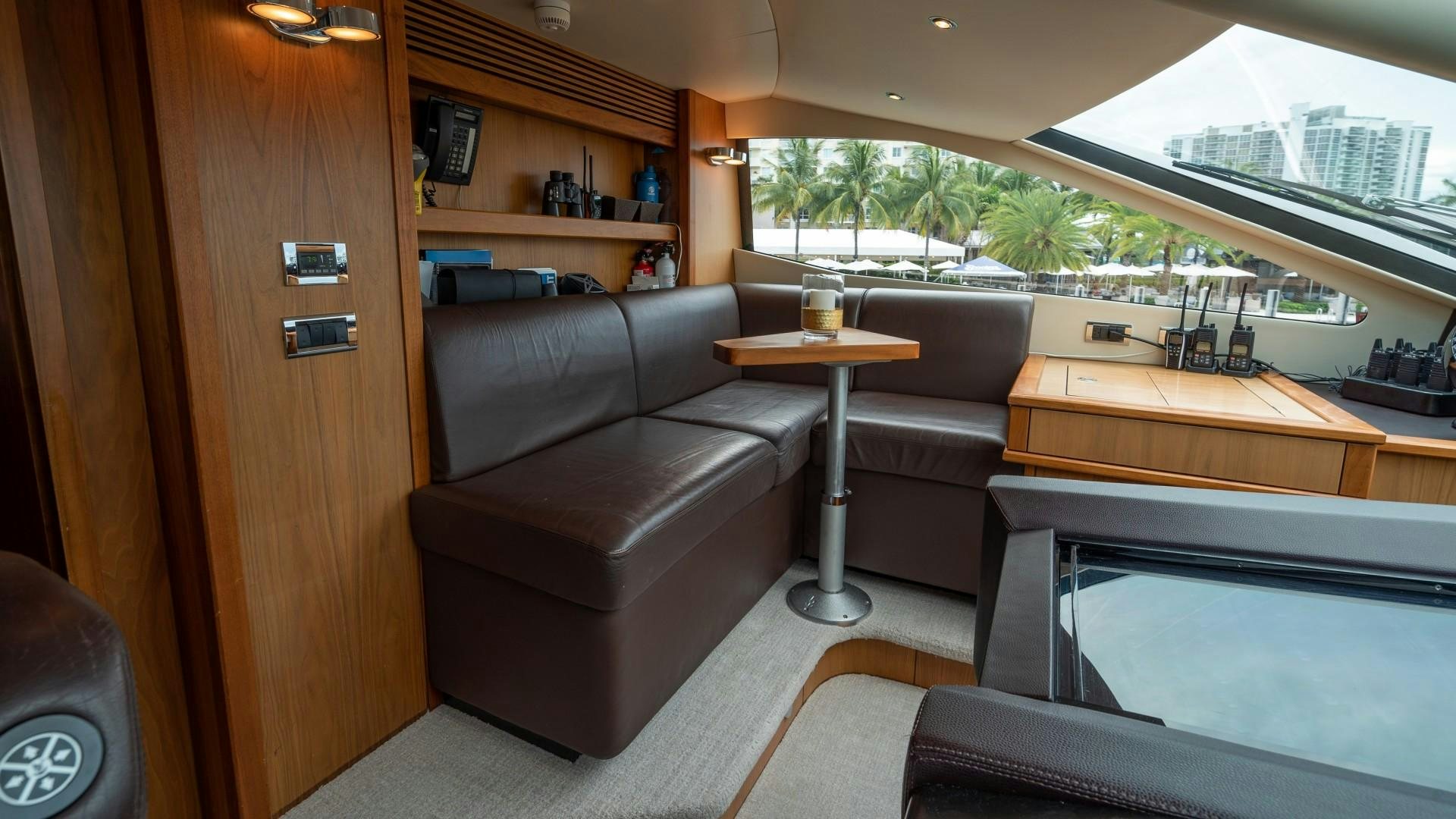 a living room with a couch and a table aboard SPLASHED OUT Yacht for Sale