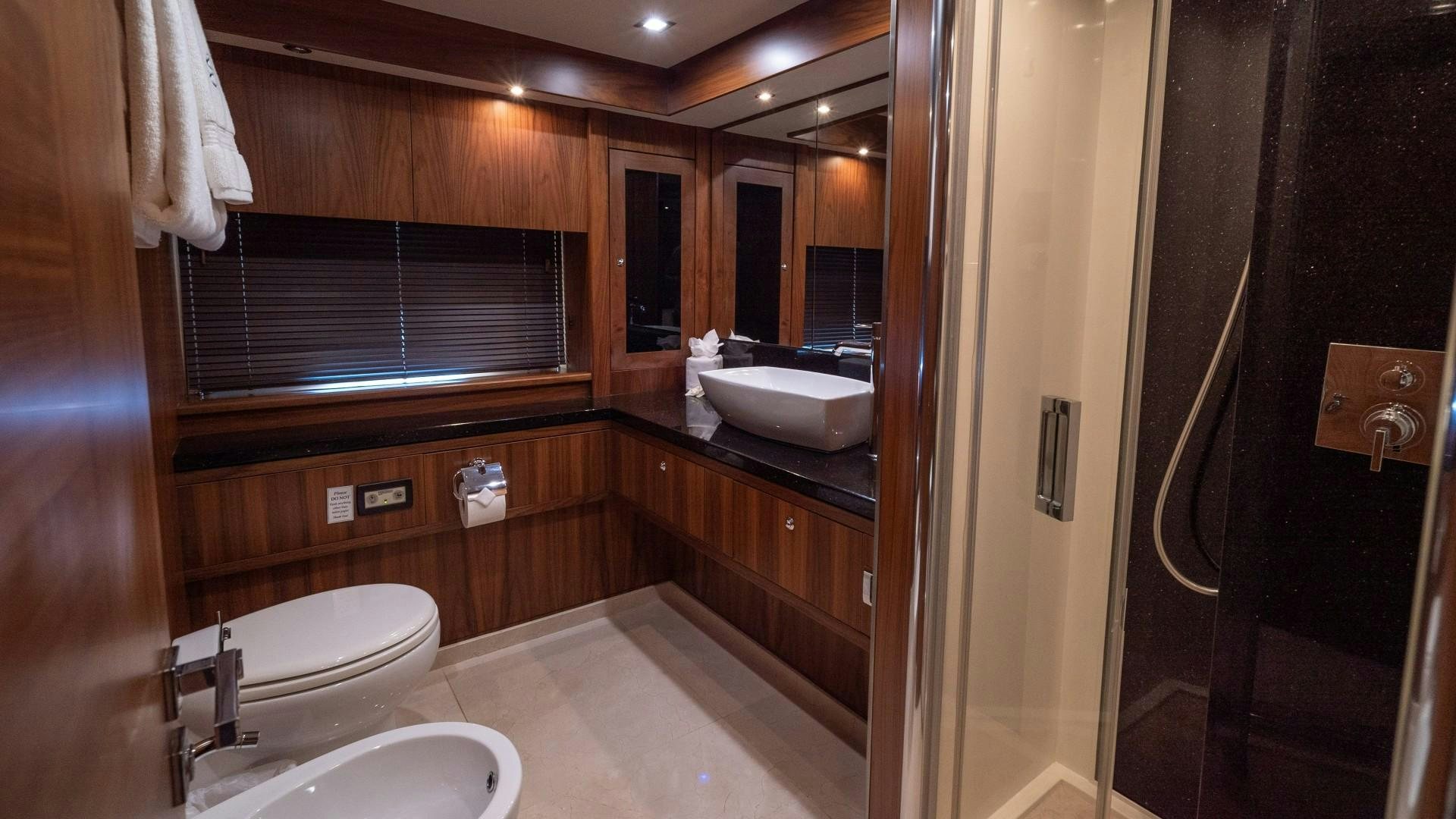 a bathroom with a sink toilet and a bathtub aboard SPLASHED OUT Yacht for Sale