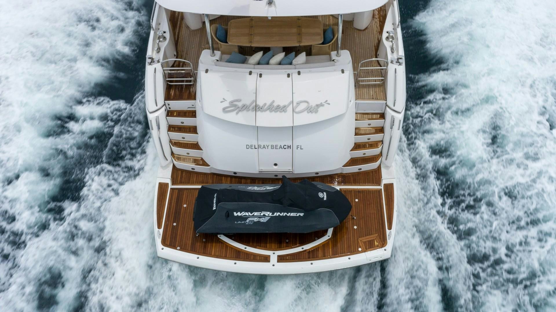a white device with a black case on a snowy surface aboard SPLASHED OUT Yacht for Sale