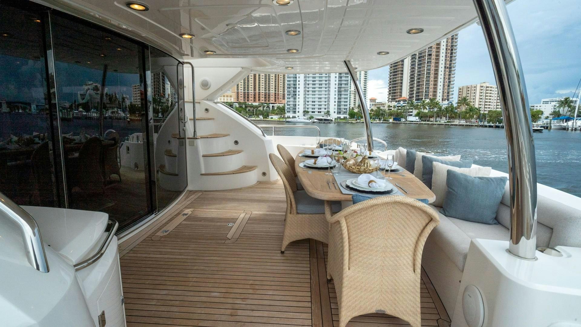 a room with a table and chairs aboard SPLASHED OUT Yacht for Sale