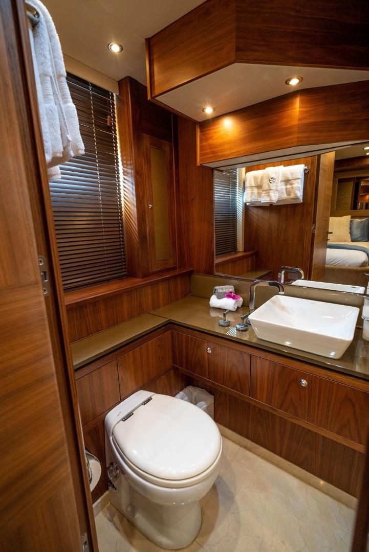 a bathroom with a sink and toilet aboard SPLASHED OUT Yacht for Sale