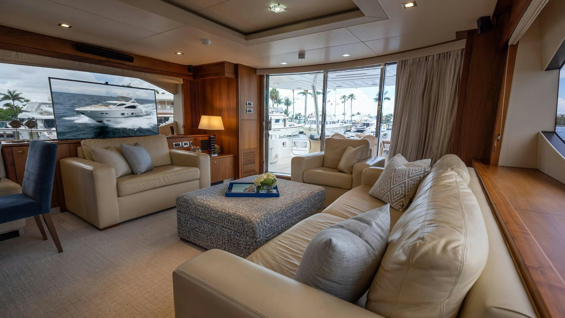 a living room with a large window aboard SPLASHED OUT Yacht for Sale