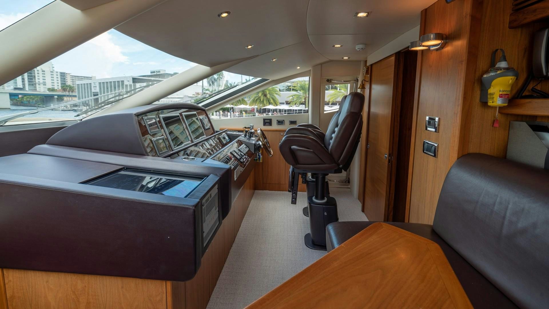 a room with a large bed and a desk aboard SPLASHED OUT Yacht for Sale