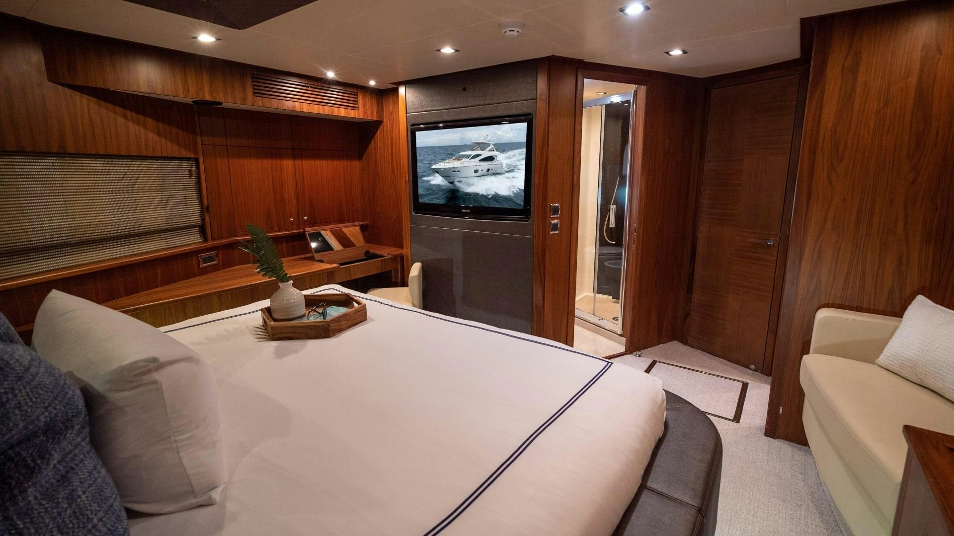 a room with a bed and a tv aboard SPLASHED OUT Yacht for Sale
