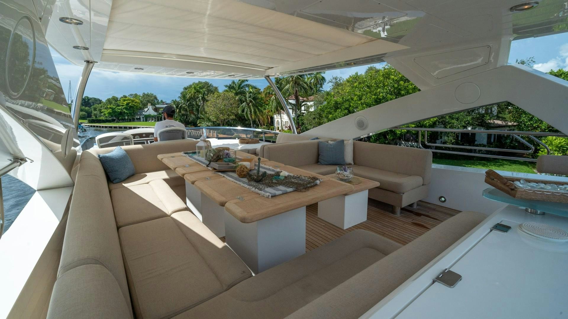 a room with a couch and a table aboard SPLASHED OUT Yacht for Sale