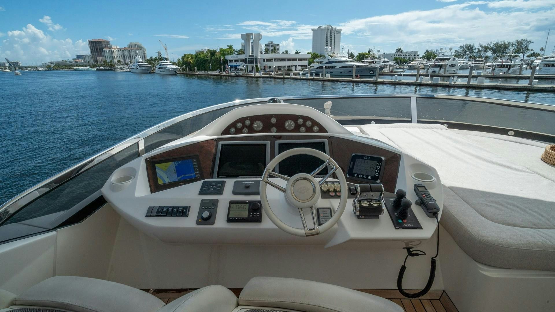a boat with a steering wheel aboard SPLASHED OUT Yacht for Sale