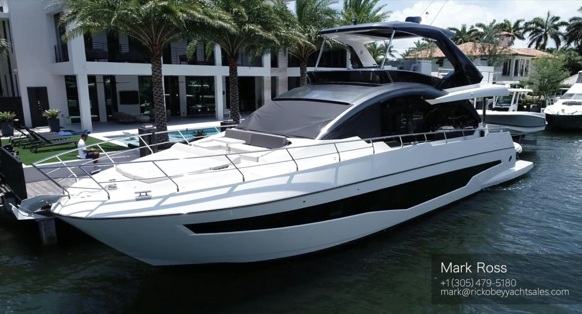 a white yacht in a harbor aboard AGRODOLCE Yacht for Sale