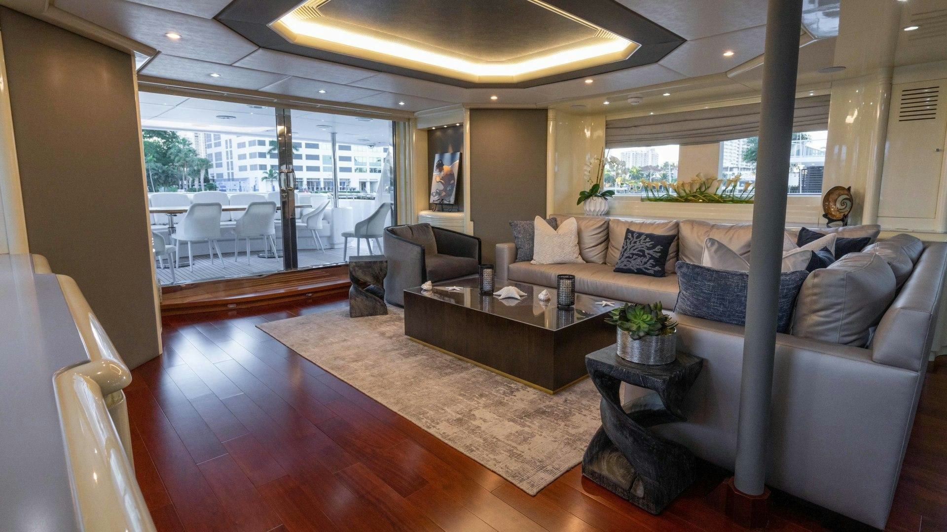a living room with a large window aboard THE PEARL Yacht for Sale