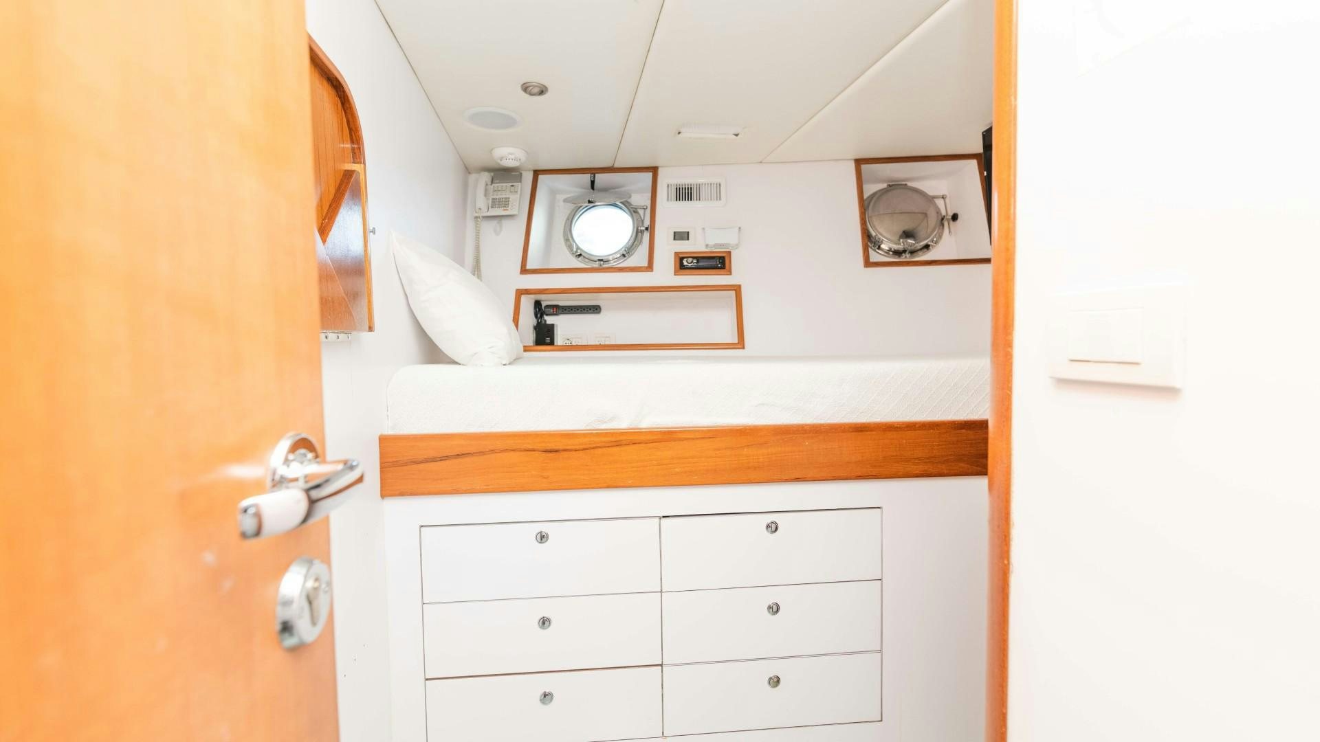 a room with a mirror and a dresser aboard THE PEARL Yacht for Sale