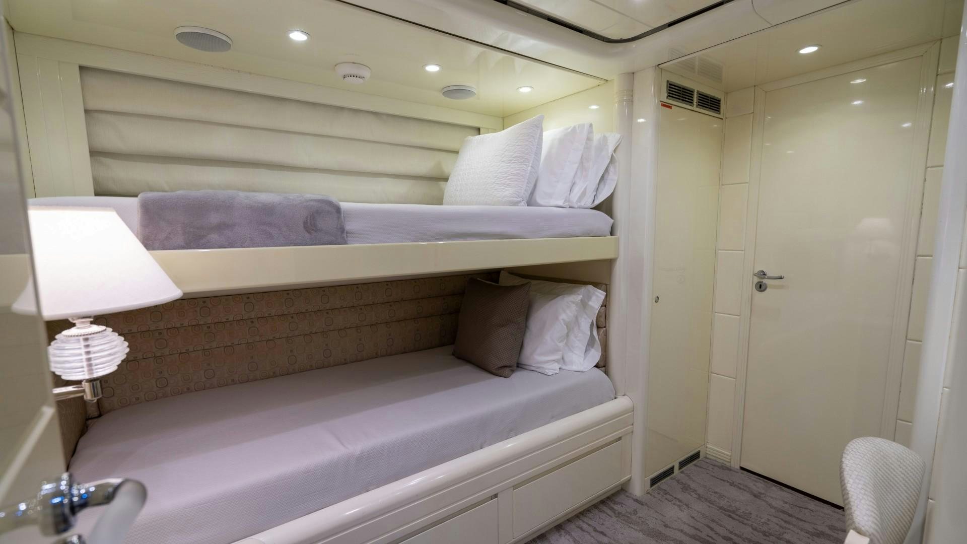 a bed with a white sheet aboard THE PEARL Yacht for Sale