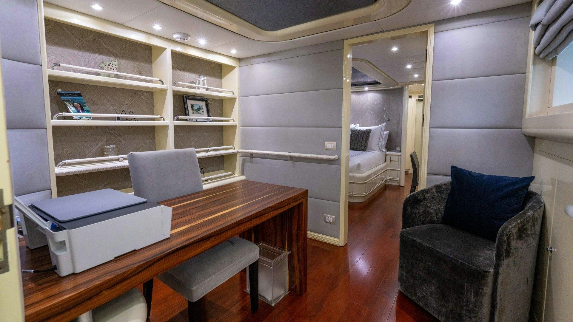 a room with a desk and a chair aboard THE PEARL Yacht for Sale