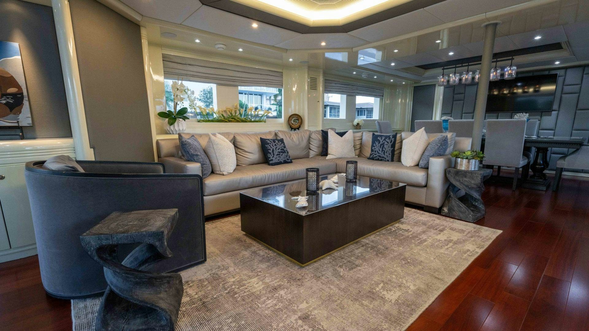 a living room with a fireplace aboard THE PEARL Yacht for Sale