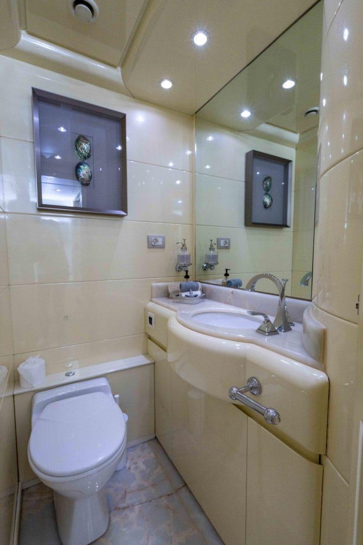 a bathroom with a sink and a toilet aboard THE PEARL Yacht for Sale