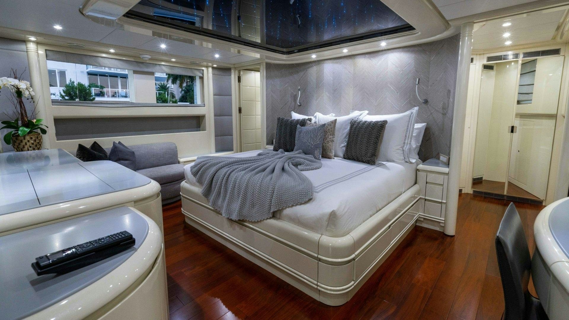 a large white bed in a room aboard THE PEARL Yacht for Sale