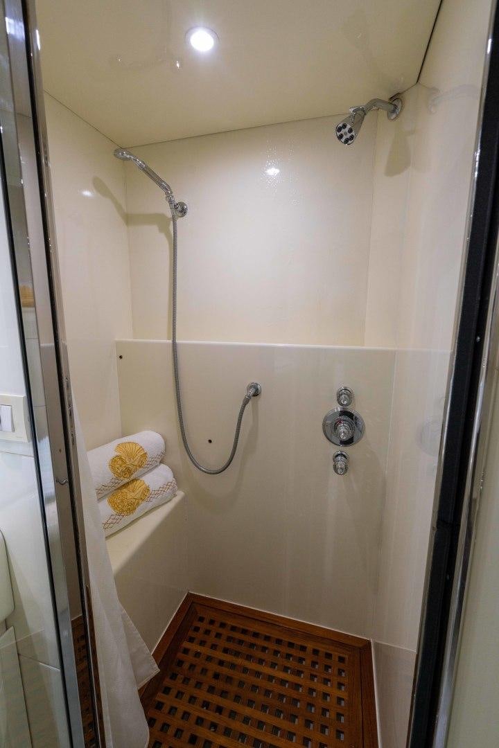 a shower with a sink and a mirror aboard THE PEARL Yacht for Sale