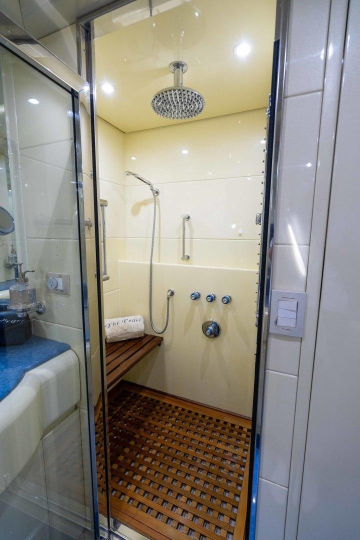 a bathroom with a shower and a sink aboard THE PEARL Yacht for Sale