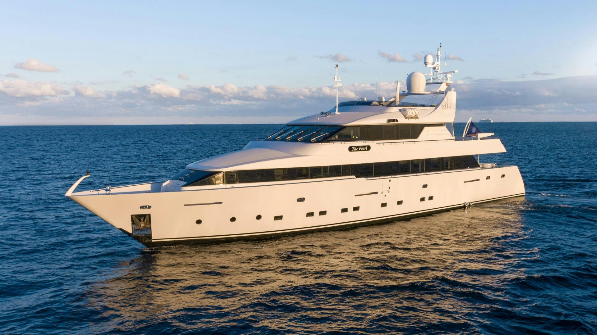 a large white yacht in the water aboard THE PEARL Yacht for Sale