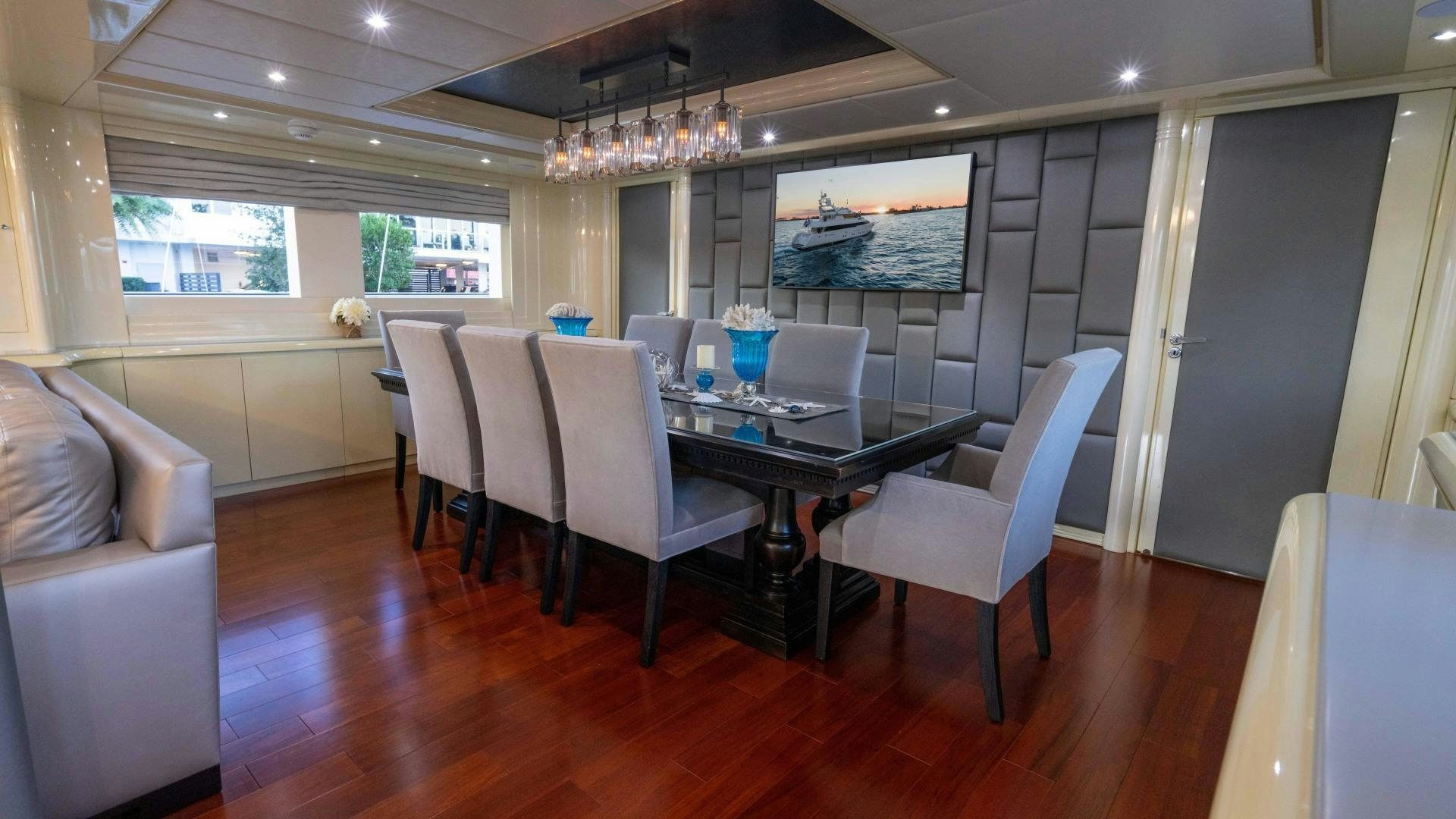 a dining room with a table and chairs aboard THE PEARL Yacht for Sale