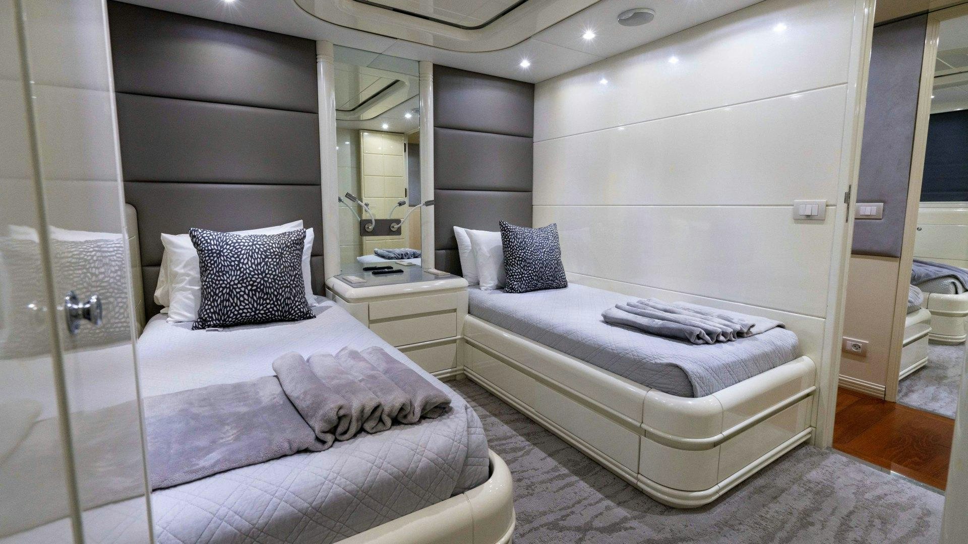 a room with two beds aboard THE PEARL Yacht for Sale