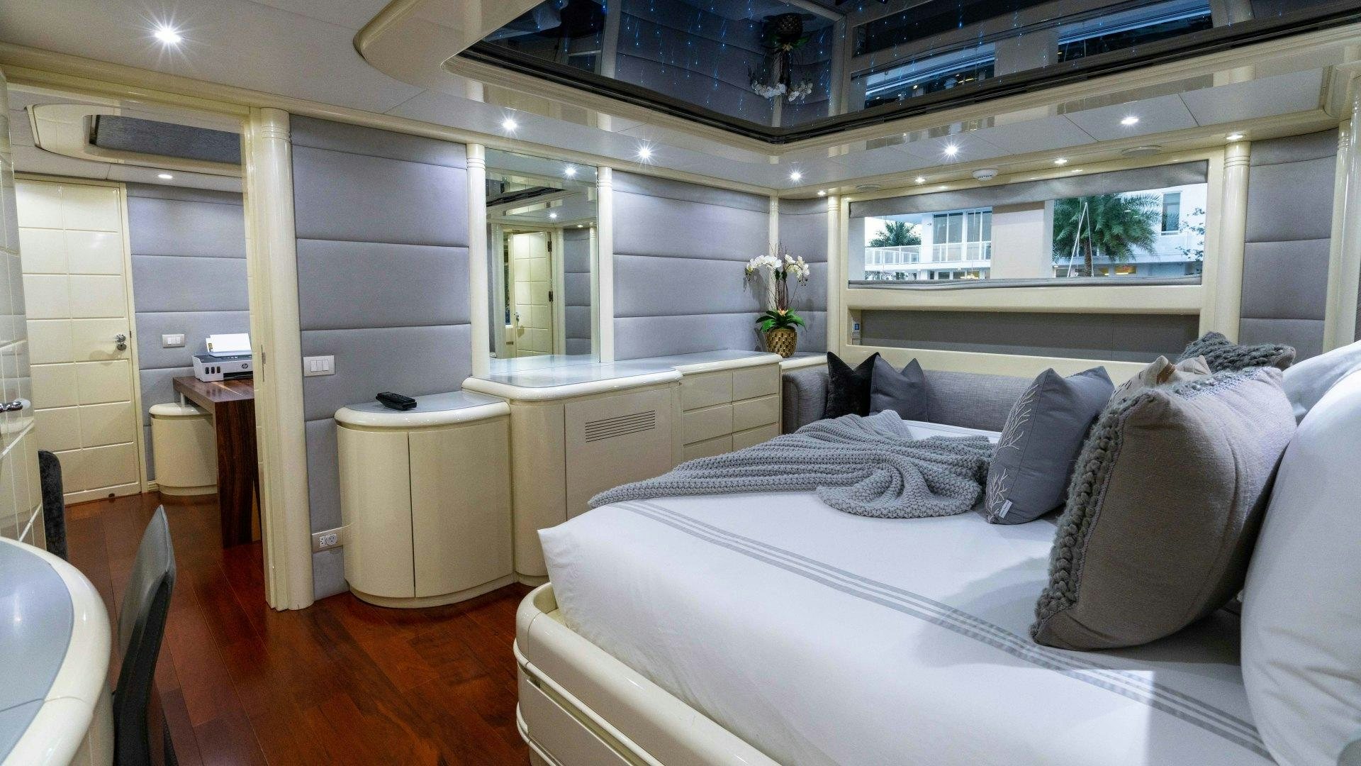a large bed in a room aboard THE PEARL Yacht for Sale