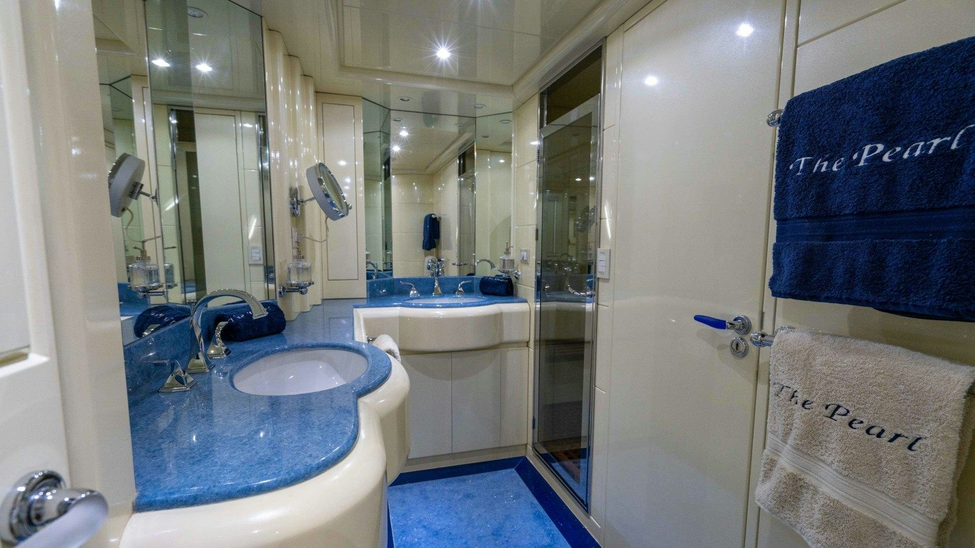 a bathroom with a sink and a mirror aboard THE PEARL Yacht for Sale