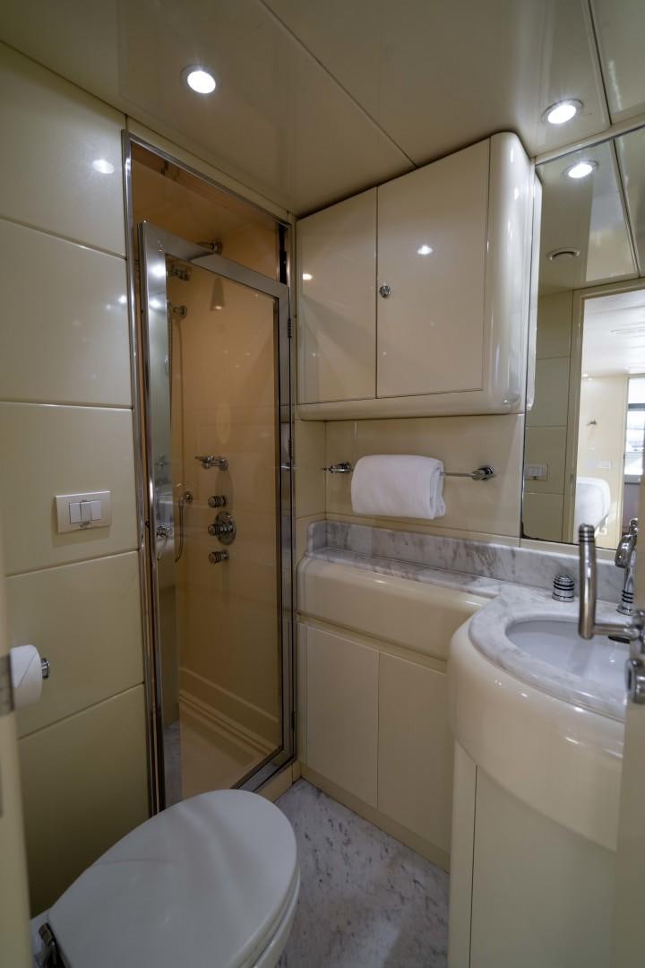 a bathroom with a shower sink and toilet aboard THE PEARL Yacht for Sale