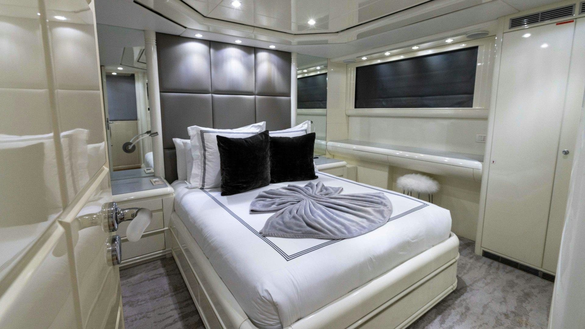 a bed in a room aboard THE PEARL Yacht for Sale