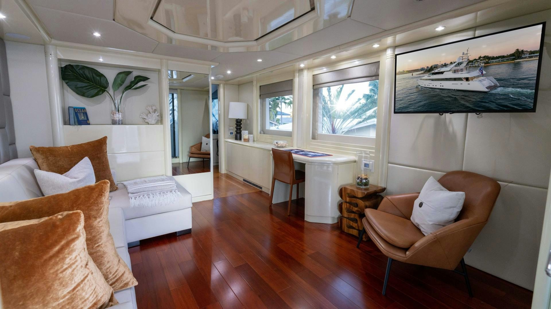 a living room with a wood floor aboard THE PEARL Yacht for Sale