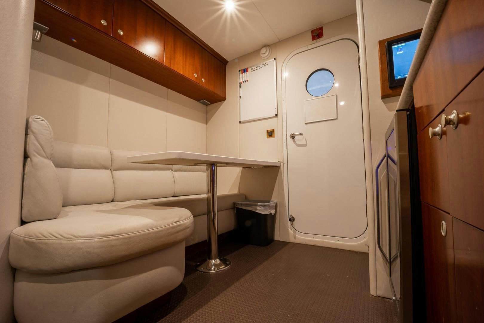 a room with a bed and desk aboard PASSION Yacht for Sale